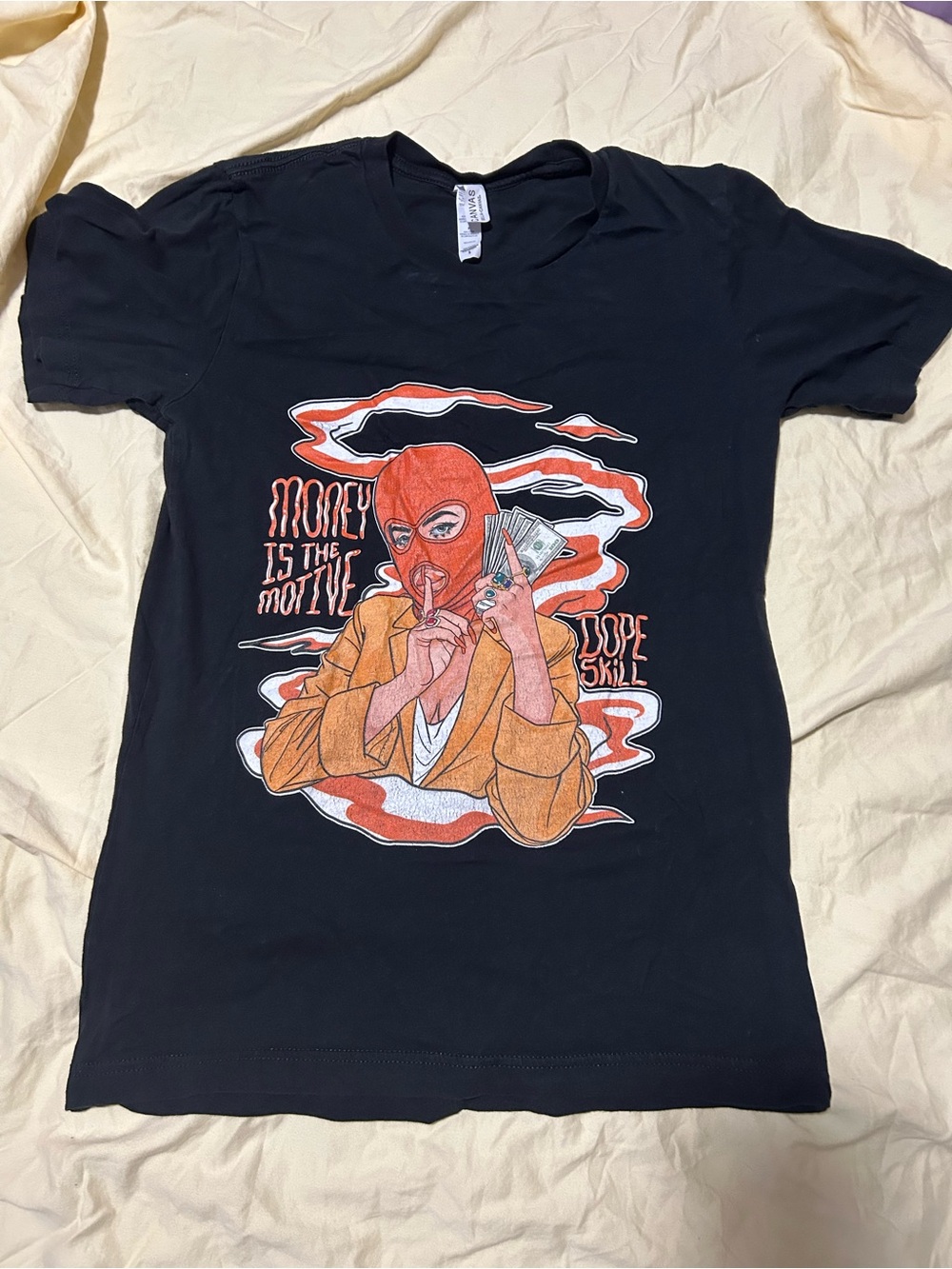 Graphic Black Tee with Red & Orange Masked Figure